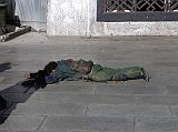 Tibet Lhasa 02 05 Jokhang Outside Prostrator In front of the Jokhang we admired the dedication of this pilgrim who was prostrating along the full Barkhor kora.